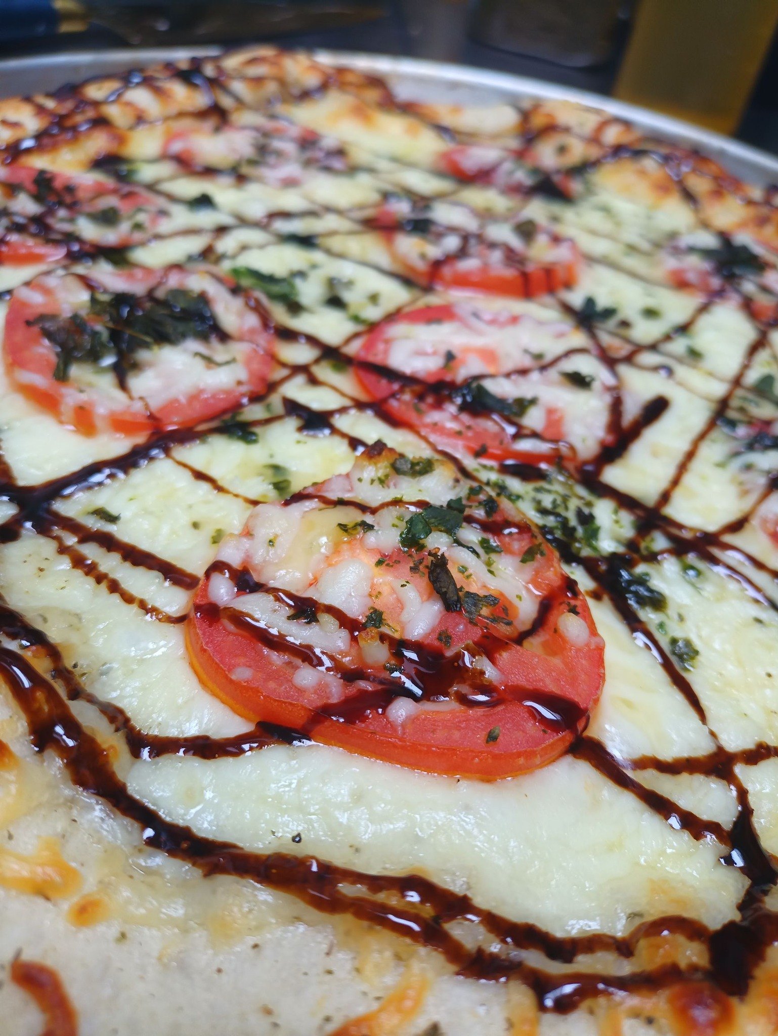 Sicilian artisan pizza with tomatoes and balsamic